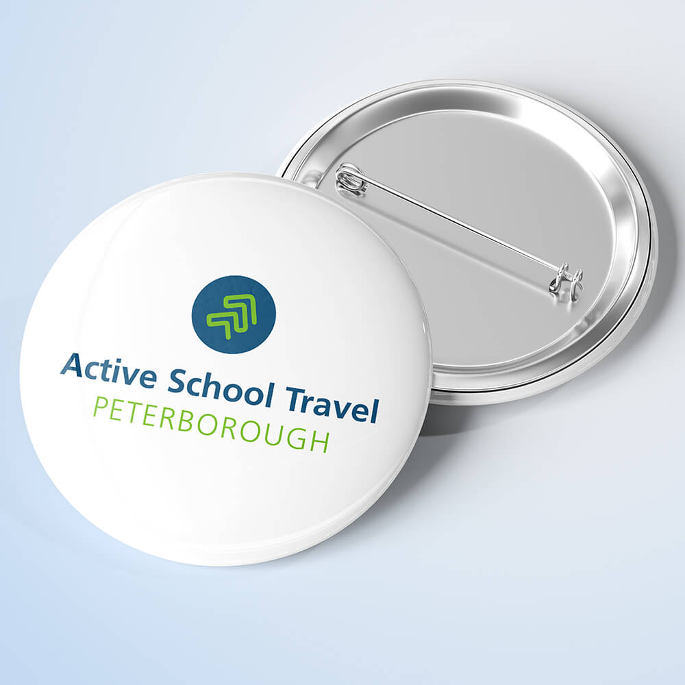 A button with Active School Travel logo on it