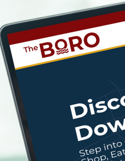 A closeup corner of a website featuring The Boro Logo